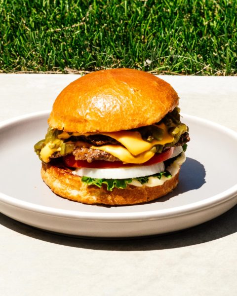 A Hatch green chile cheeseburger might be the best thing from New Mexico. Super juicy, slightly spicy, and oh so addictive. This is the burger recipe you want to be making right now. #burger #burgerrecipe #recipes #dinner #dinnerrecipes #cheeseburger #newmexico